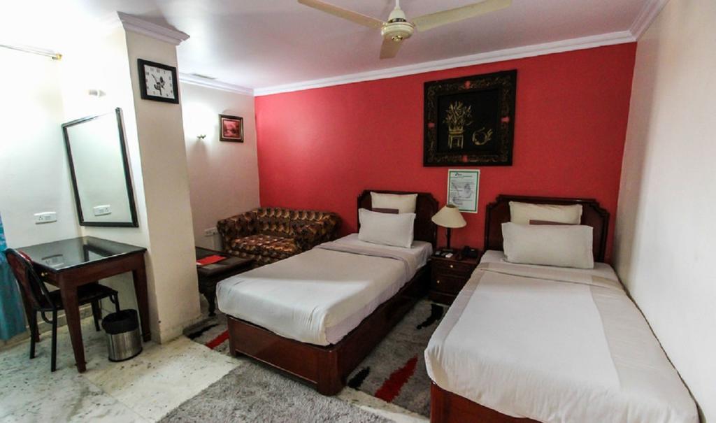 Hotel Pigeon International Bangalore Kamer foto