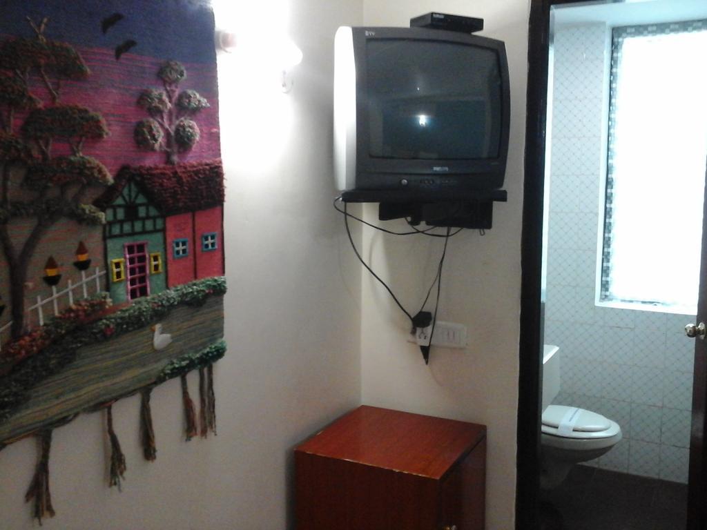 Hotel Pigeon International Bangalore Kamer foto